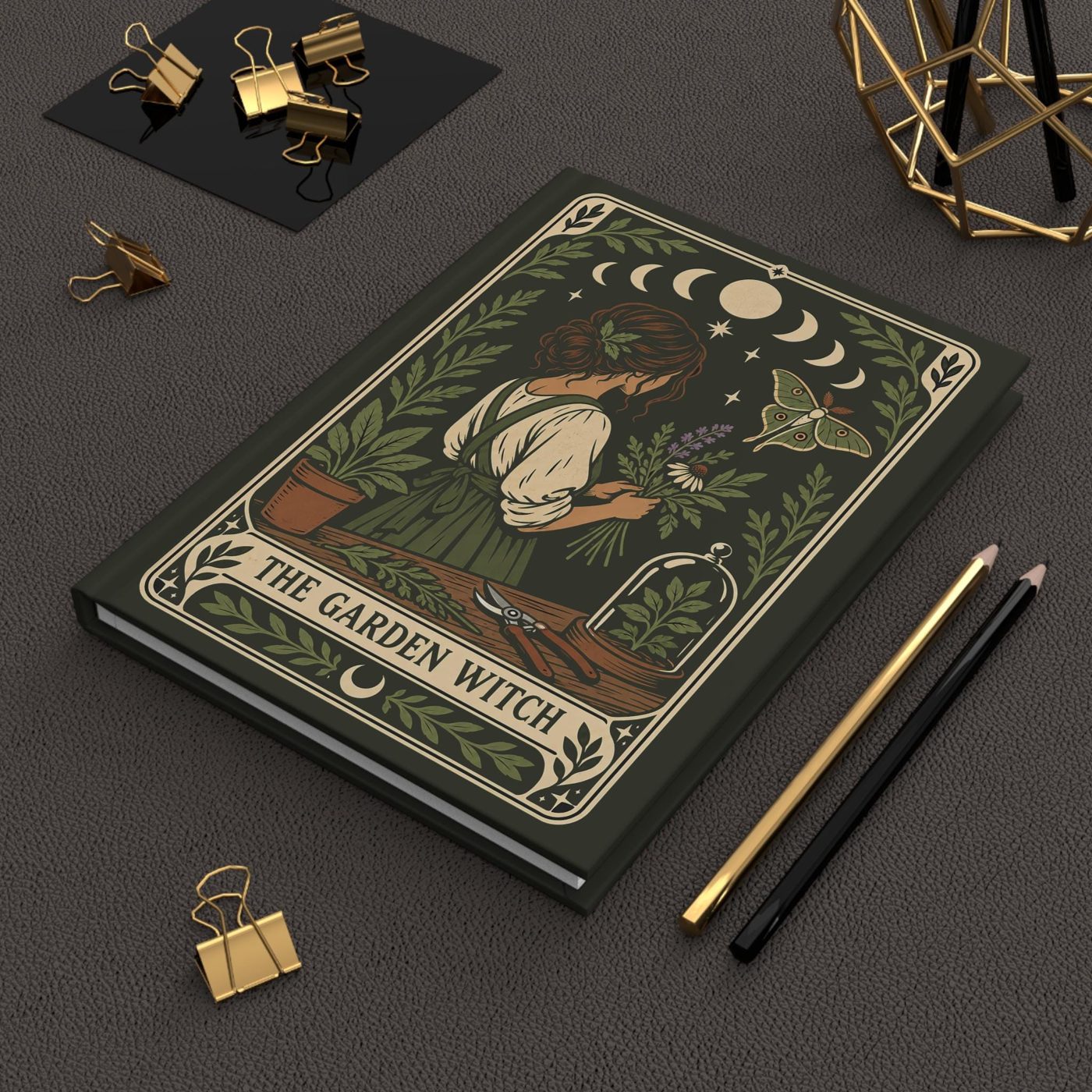 Hardcover journal with a garden witch gathering herbs under the moon phases, in forest green with a luna moth